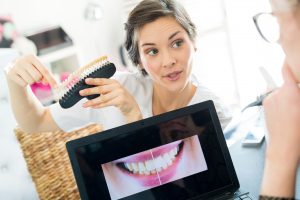 teeth technician showing some implant samples