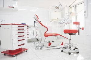 Dental clinic interior, design with chair and tools. All furniture in the same color.